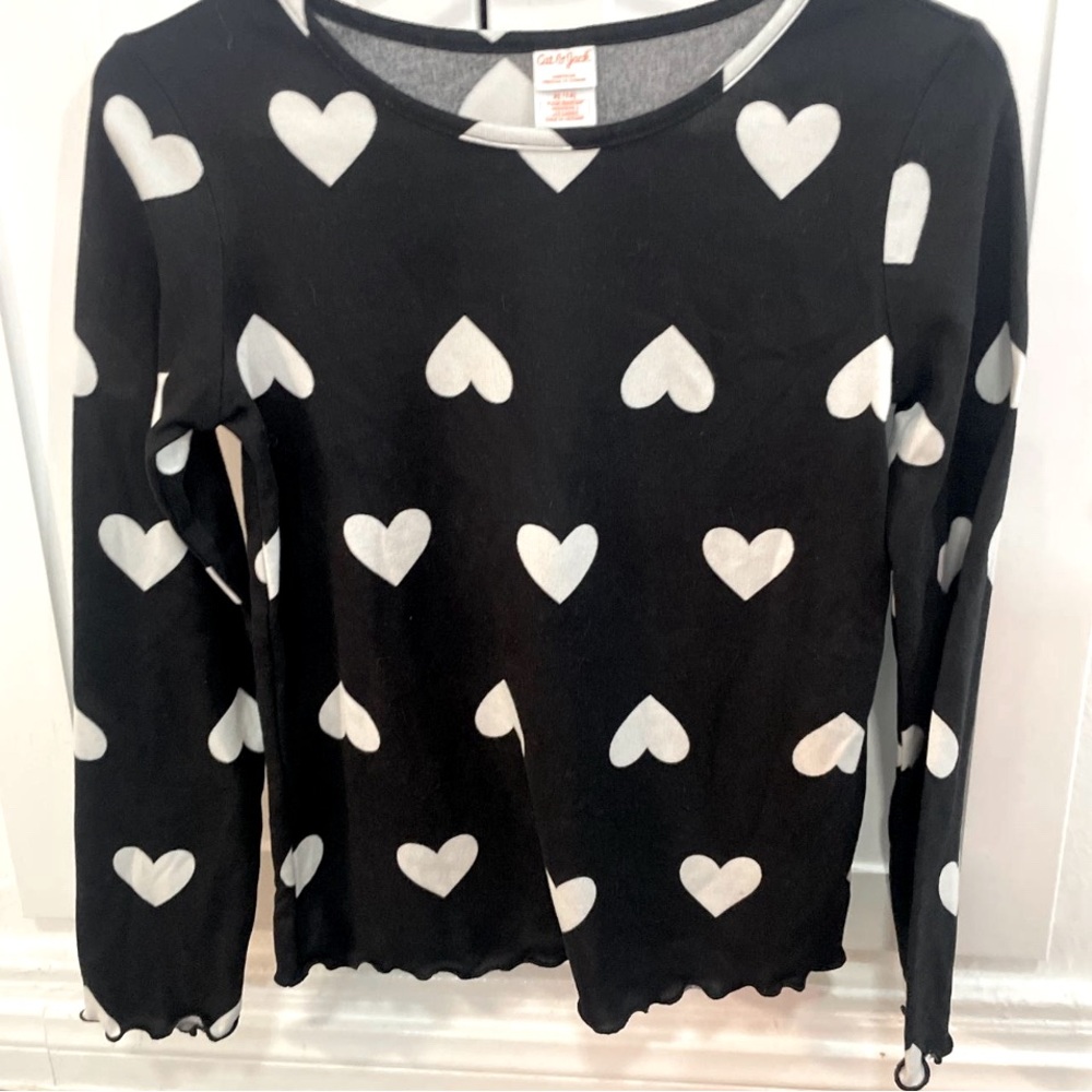 Girls XL black long sleeve shirt with white hearts. Never worn